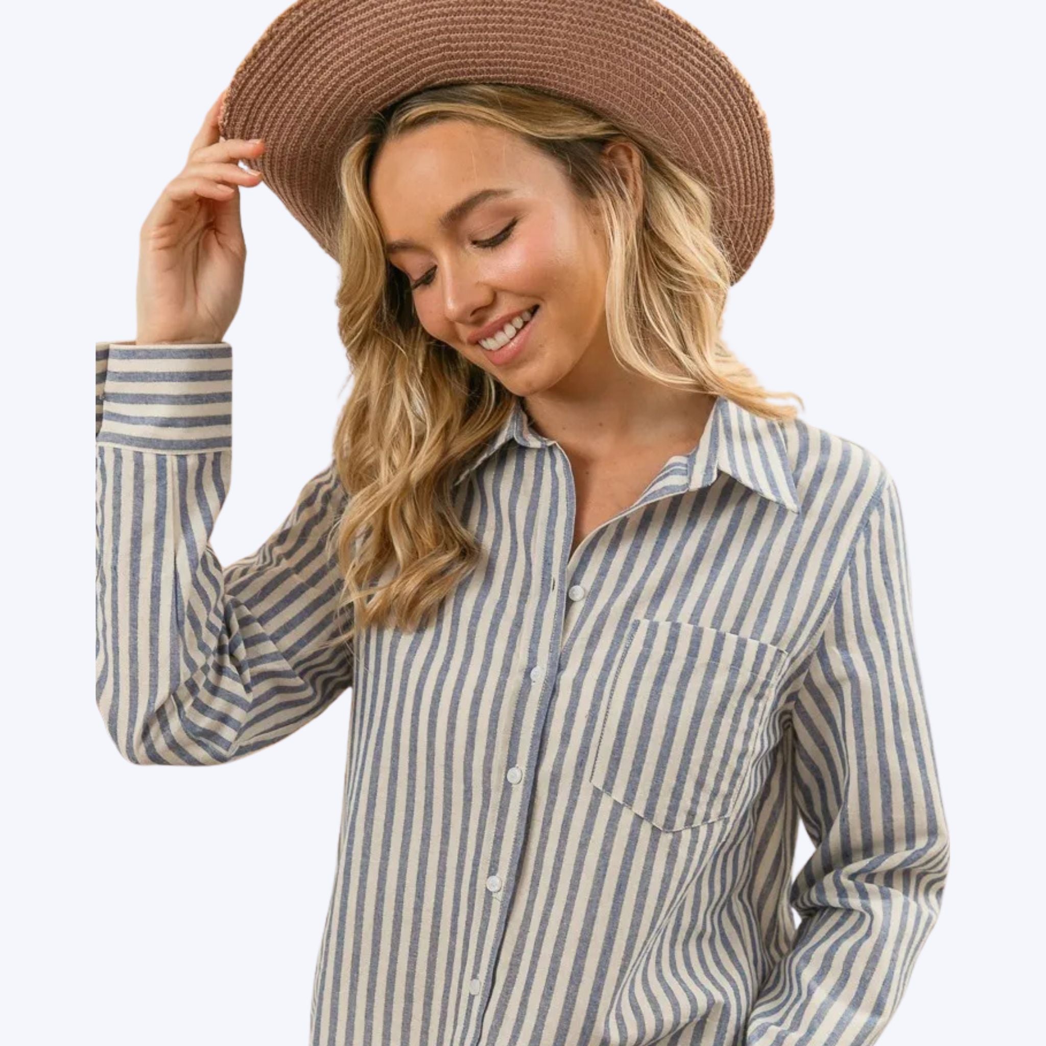 woman wearing BiBi striped button-up shirt with long sleeves and straw hat
