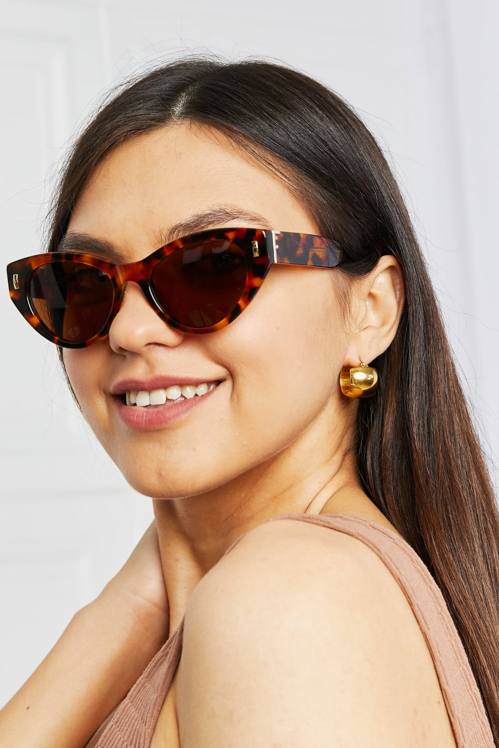 tortoiseshell acetate frame sunglasses shown as apparel
