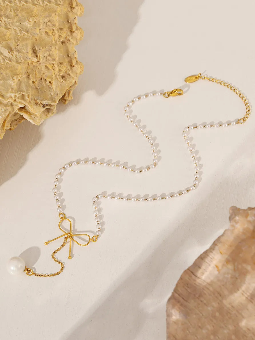 stainless steel bow pendant necklace with pearls — women’s activewear view