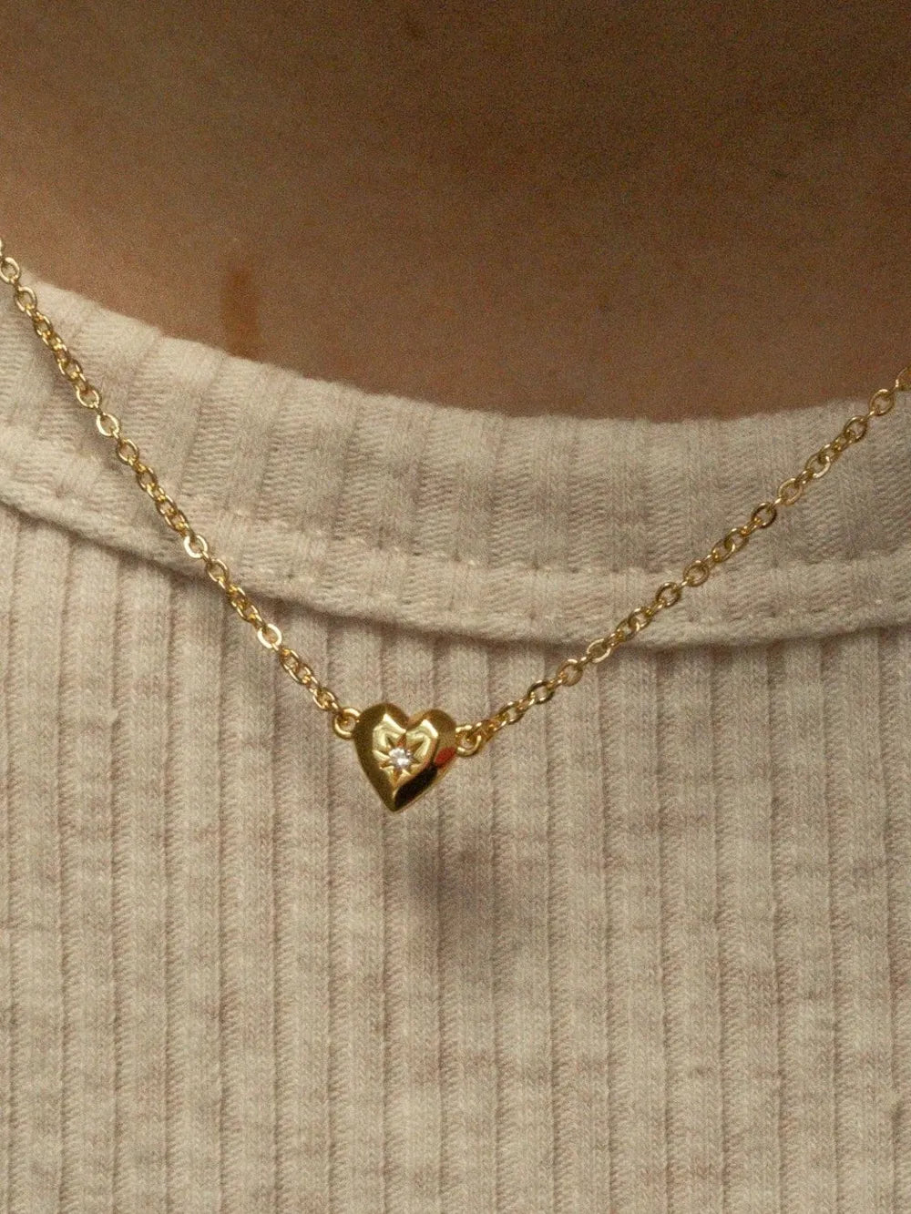 zircon heart pendant necklace styled as a women’s apparel