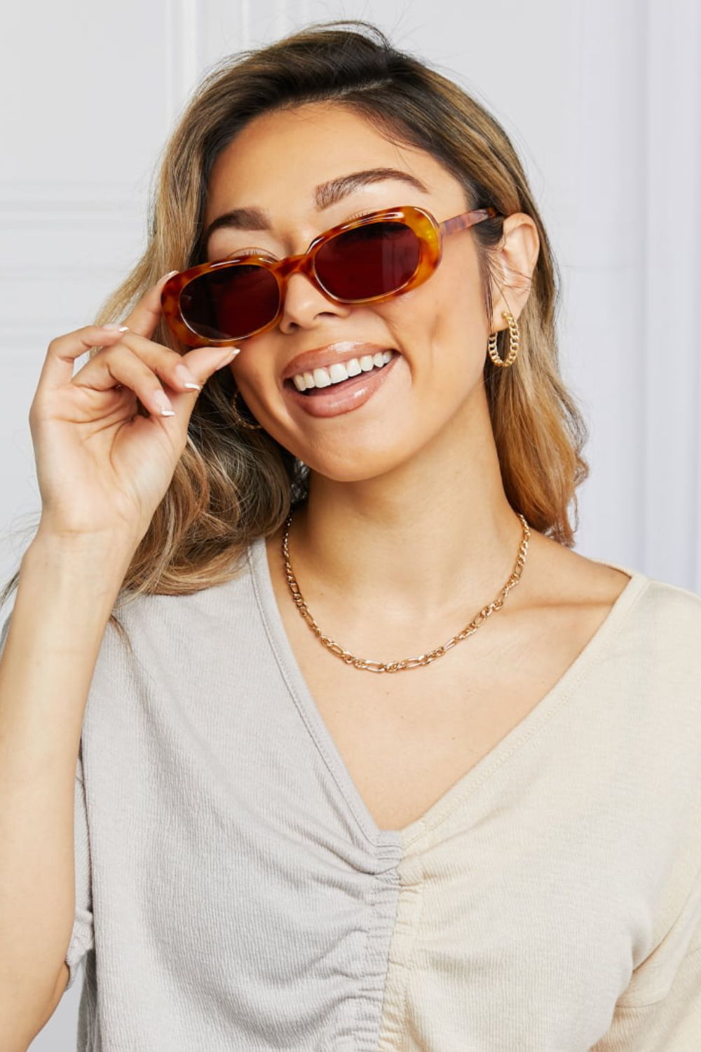 oval full rim sunglasses shown as apparel