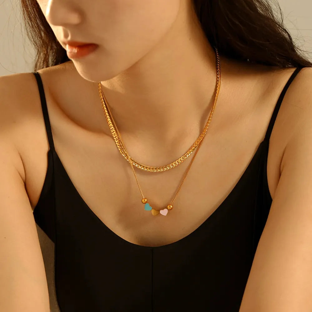 18k gold-plated double layered heart necklace shown as women’s apparel