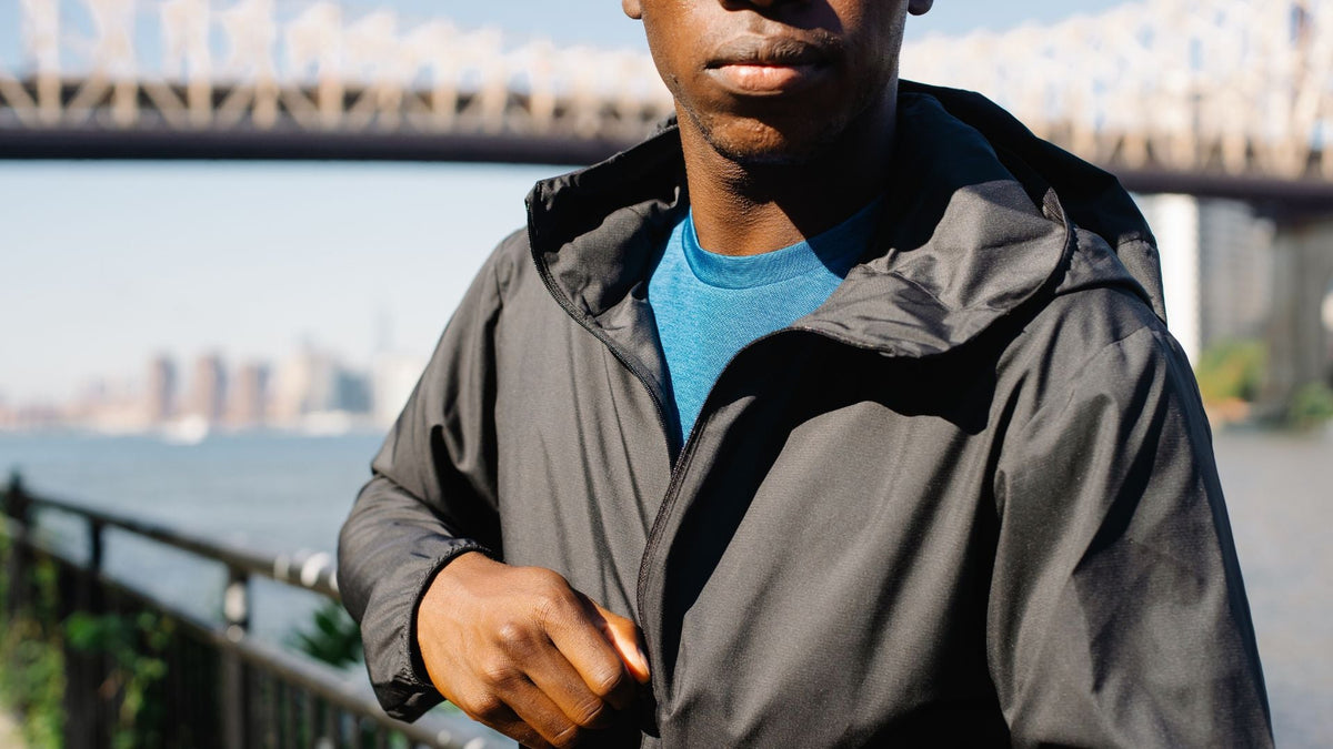 man wearing black hooded zip-up autumn jacket outdoors – Donjane men’s autumn jackets 2025