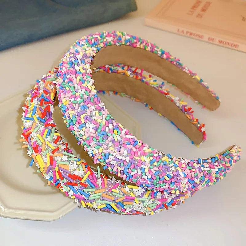 close-up of colorful acrylic wide headband in contrasting hues

