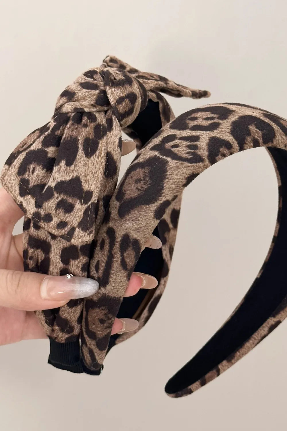twisted animal print headband with plush interior lining