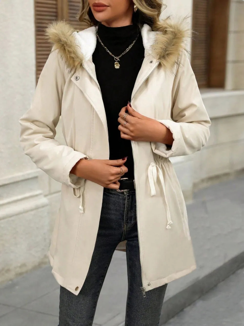 snap-front winter jacket for women layered over knits