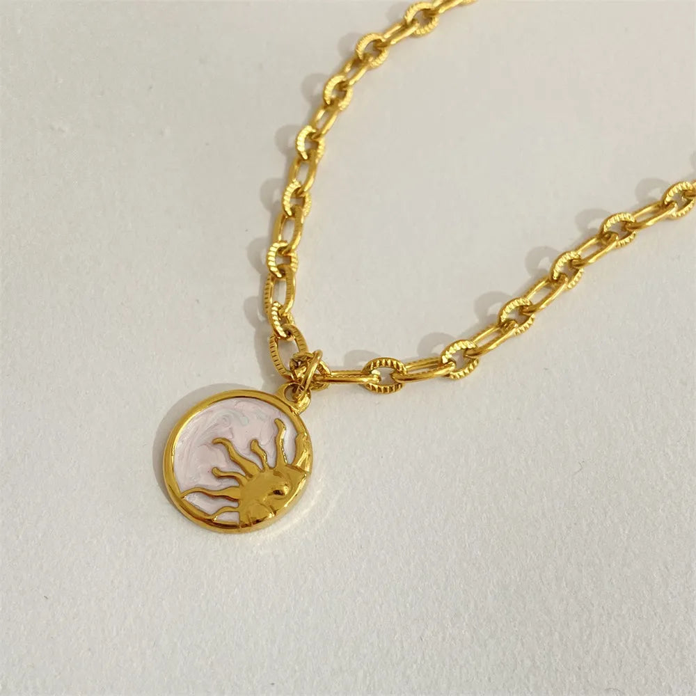 titanium steel sun & moon necklace shown as women’s activewear