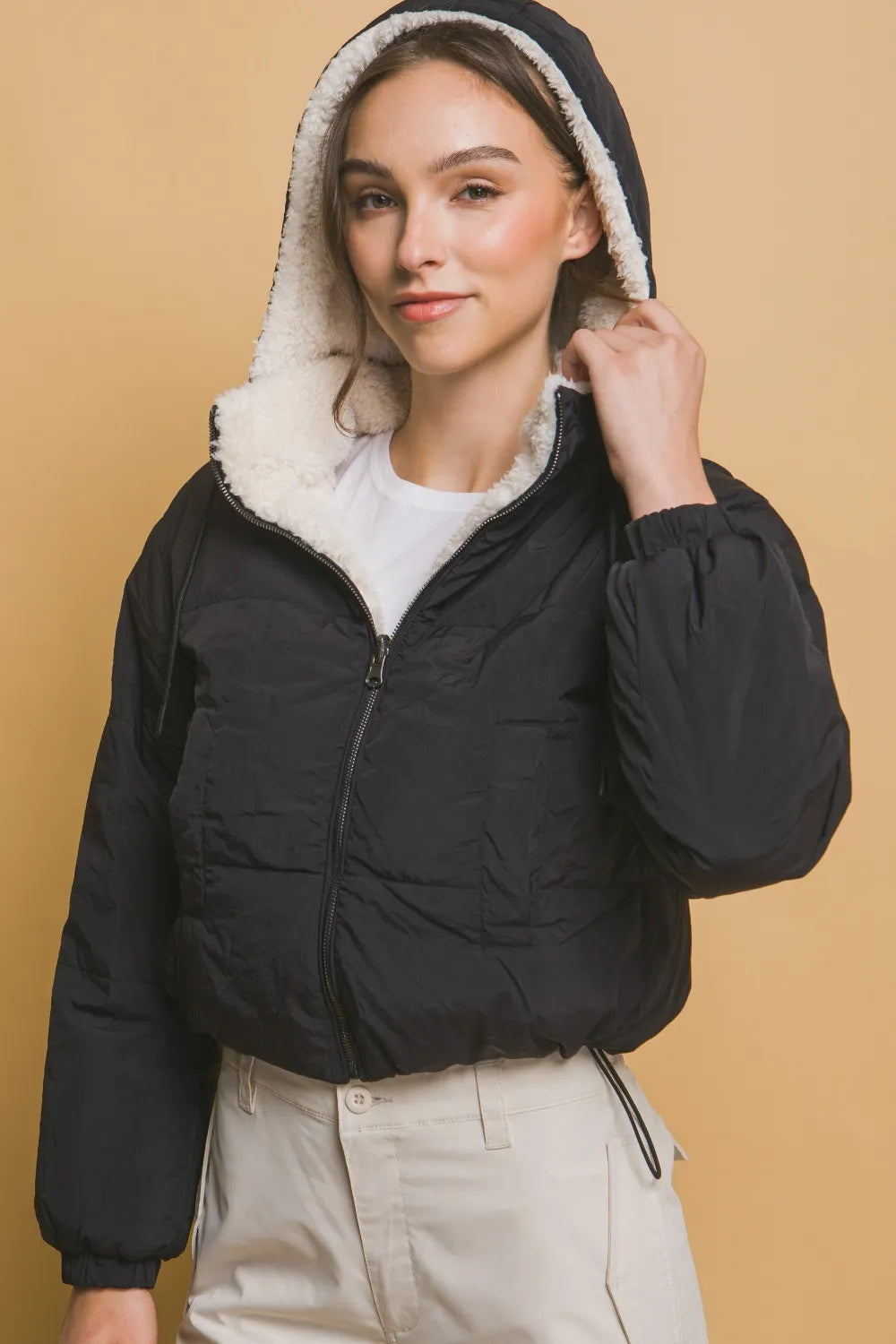 lined winter jacket for women in studio lighting
