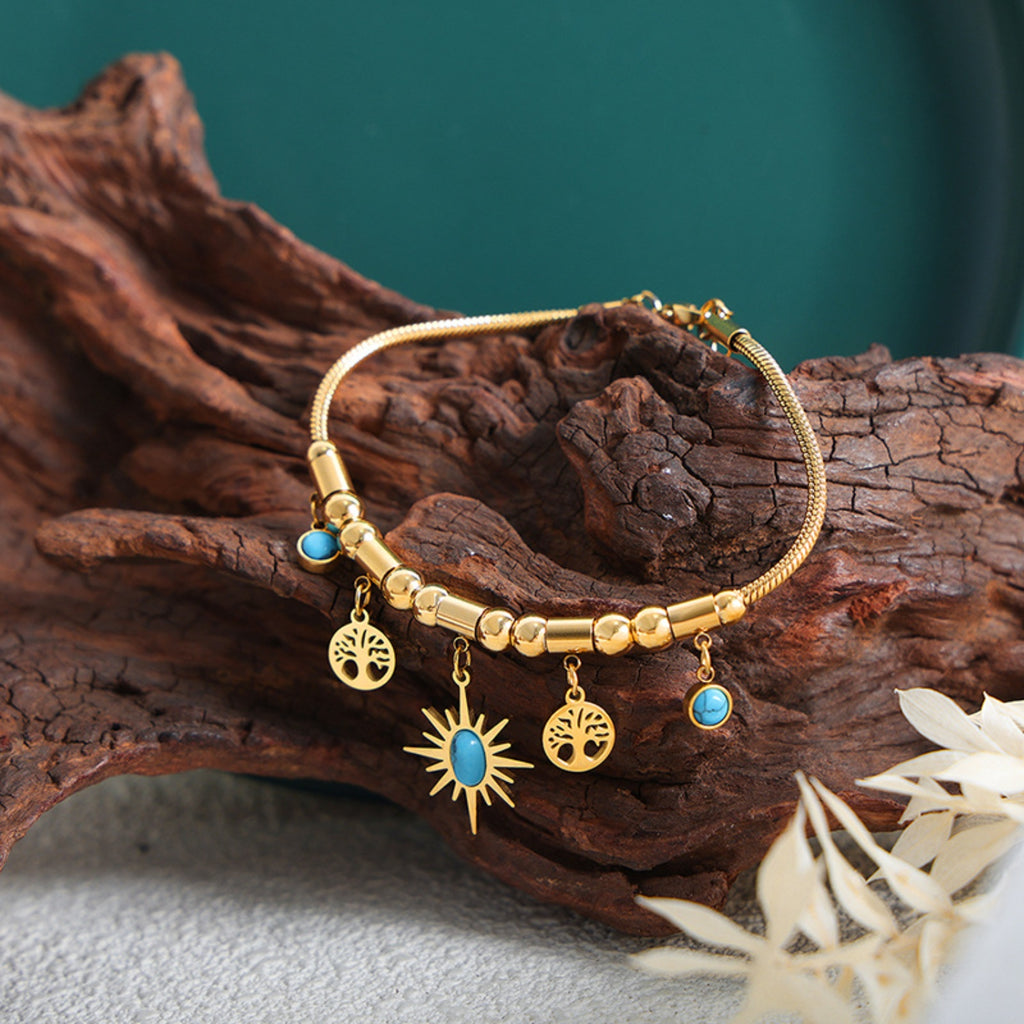 gold-plated titanium steel charm bracelet — activewear view