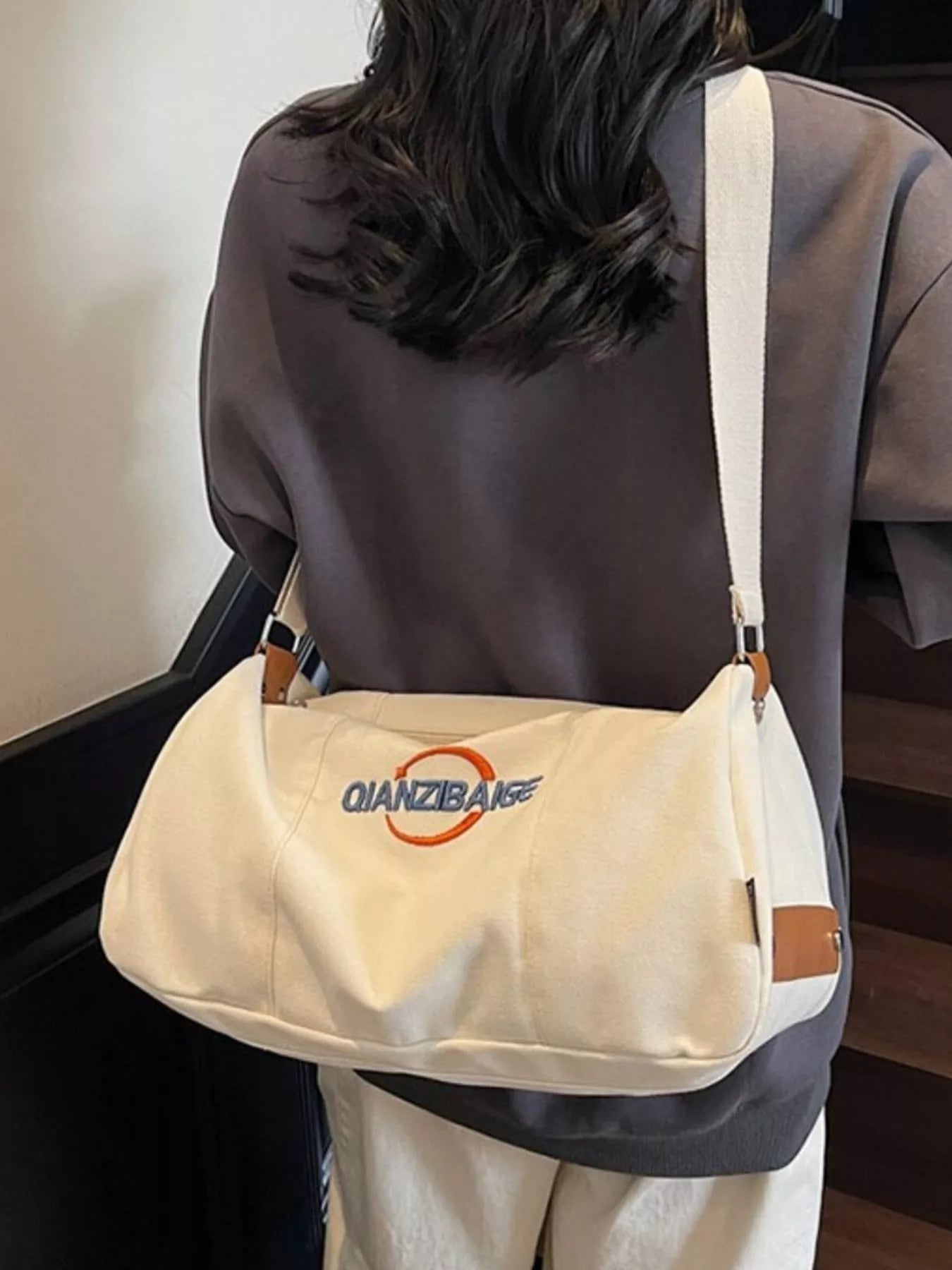 women's canvas duffel bag with adjustable shoulder strap - side view