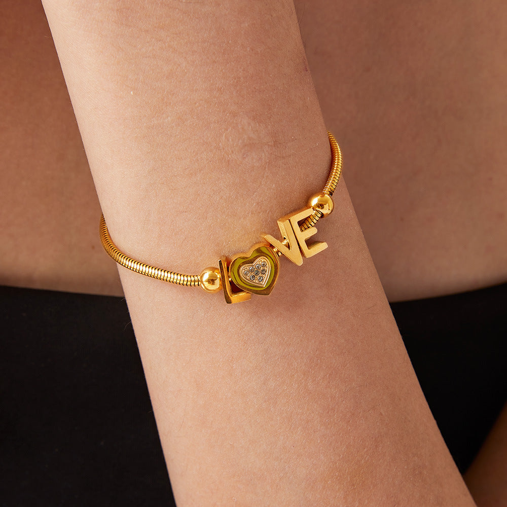 titanium steel rhinestone letter bracelet styled as activewear