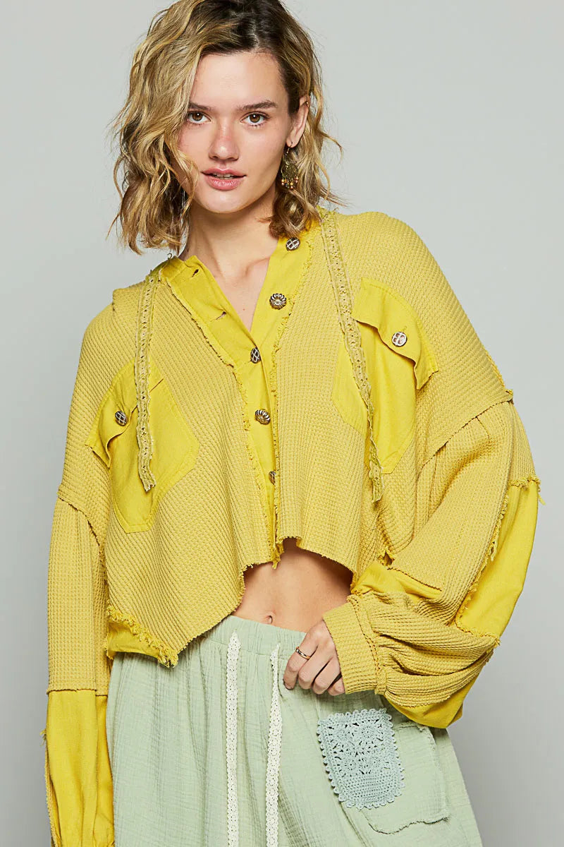 puffer outerwear jacket layered over knitwear