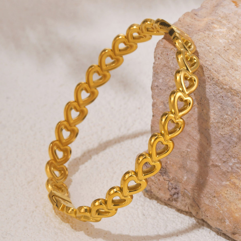 18k gold-plated stainless steel heart bracelet shown as activewear