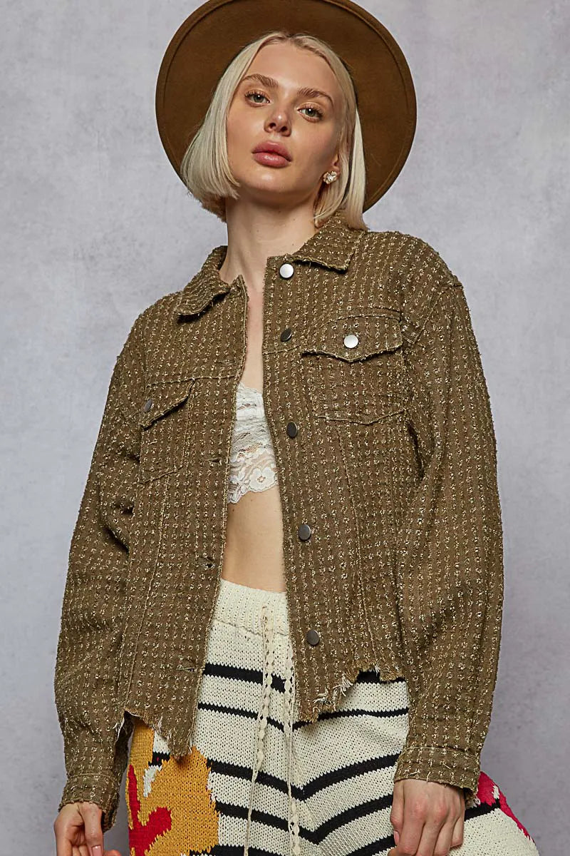 hooded outerwear jacket layered over knitwear