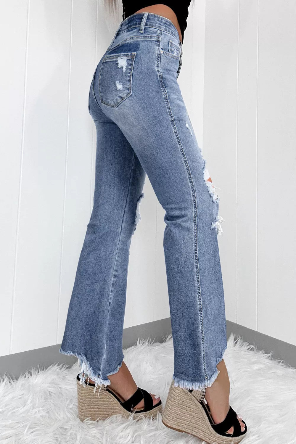 women's distressed flare jeans - detail shot