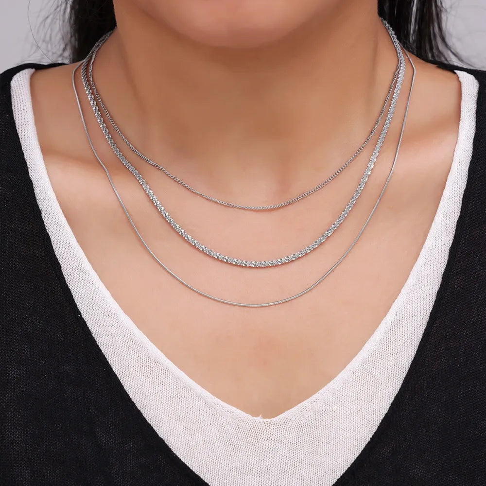 titanium steel three-layered necklace shown as women’s activewear
