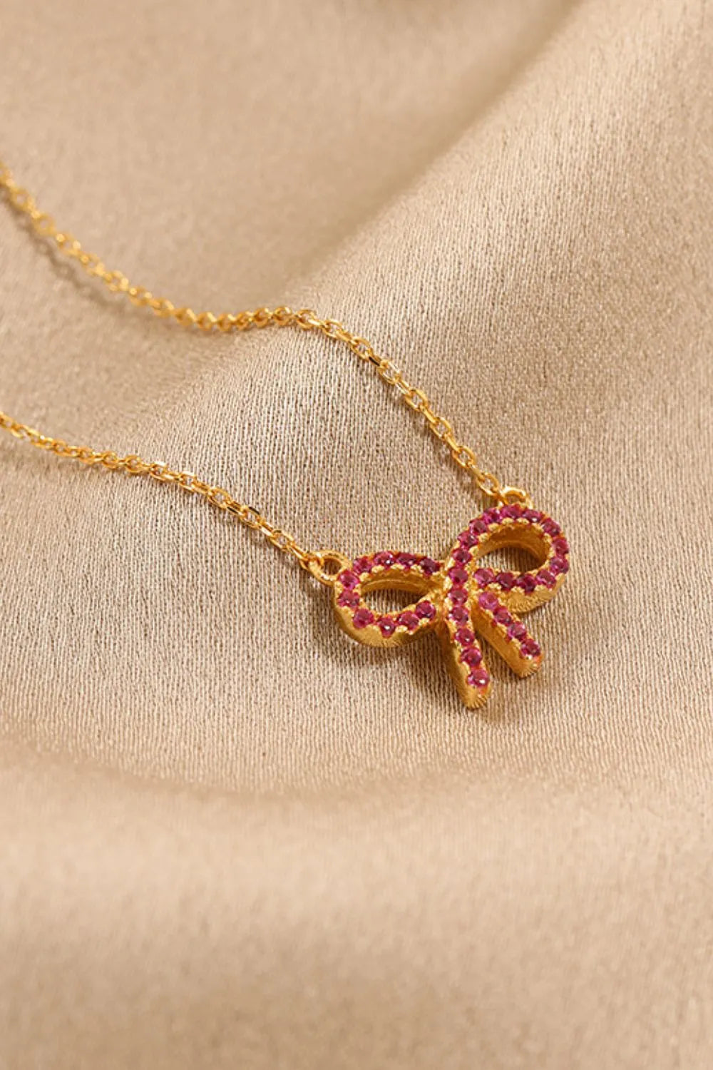 925 sterling silver bow necklace shown as women’s apparel