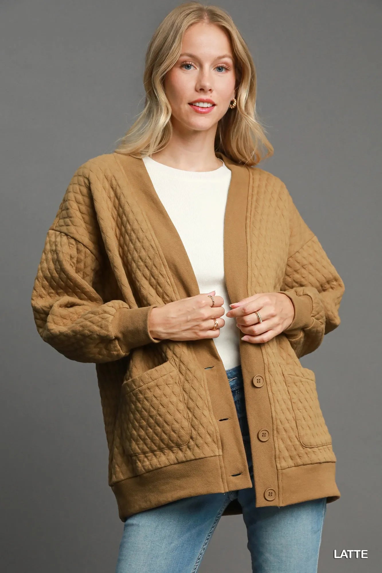 belted outerwear jacket paired with scarf