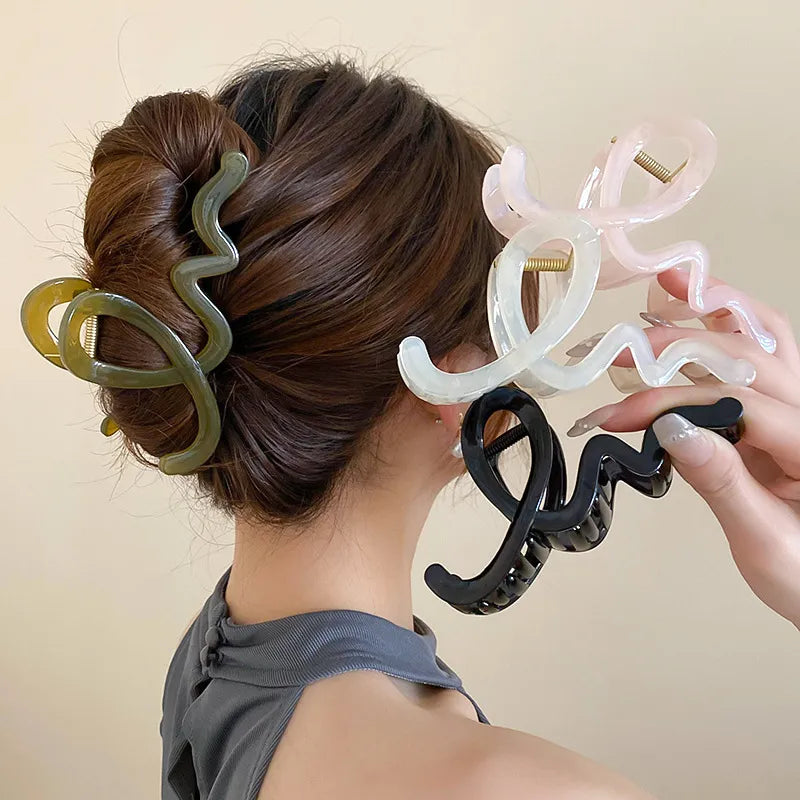 close-up of chunky rainbow hair accessory on brunette hair