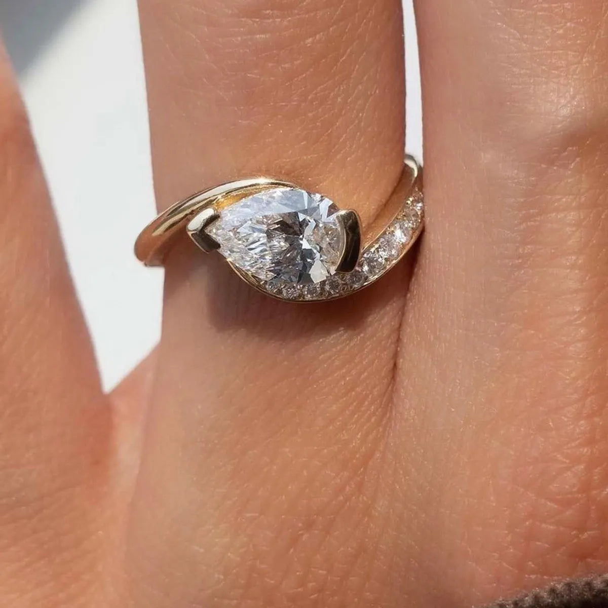 Donjane! gold moissanite ring on hand – 1.5 carat sparkle with zircon accents, elegant fit