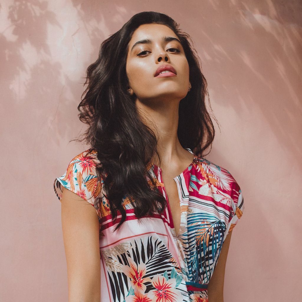 About Donjane! – bold Latina woman in floral fashion, representing global women's apparel brand Too Fine For Basic