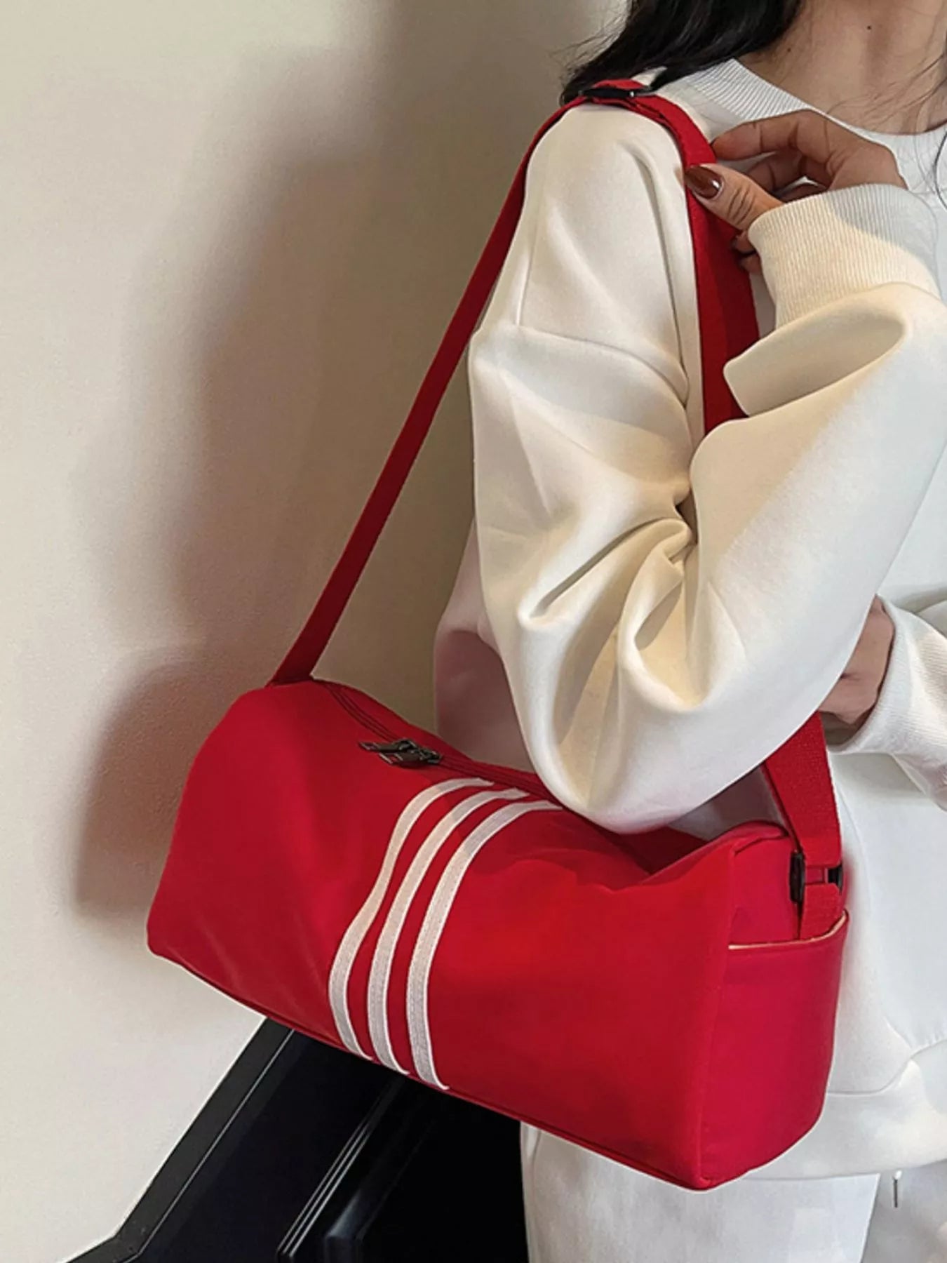 women's striped adjustable strap duffel bag - detail shot
