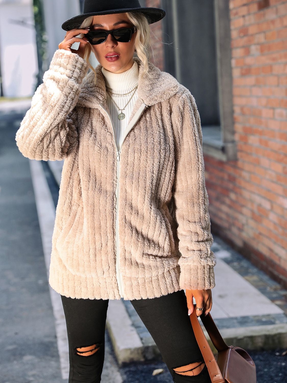 belted winter jacket for women styled with boots