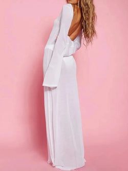 White backless maxi cover-up — rear three-quarter view showing deep open back and long bell sleeves