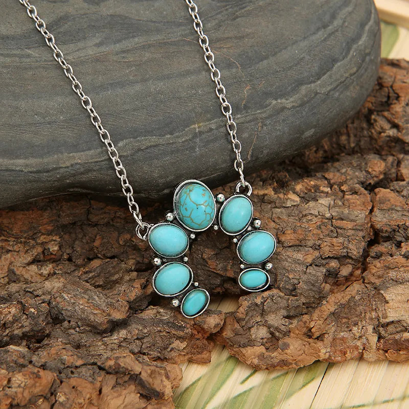 artificial turquoise alloy pendant necklace styled as a women’s apparel