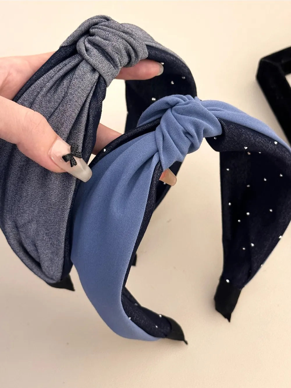 two-tone knotted headbands in denim blue, grey, and black