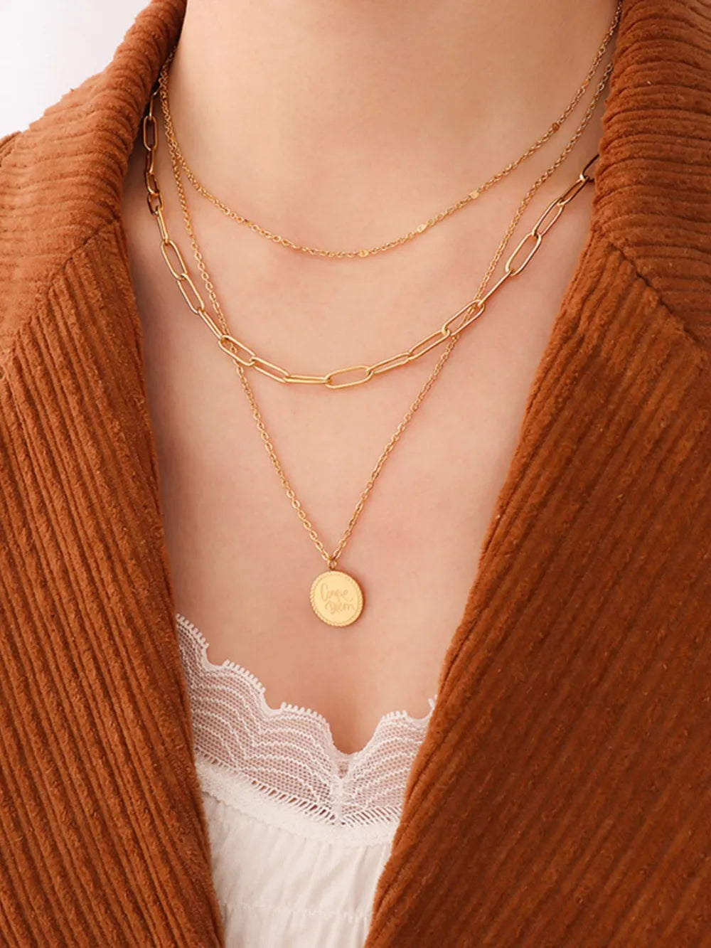 18k gold-plated three-layered engraved necklace styled as a women’s apparel