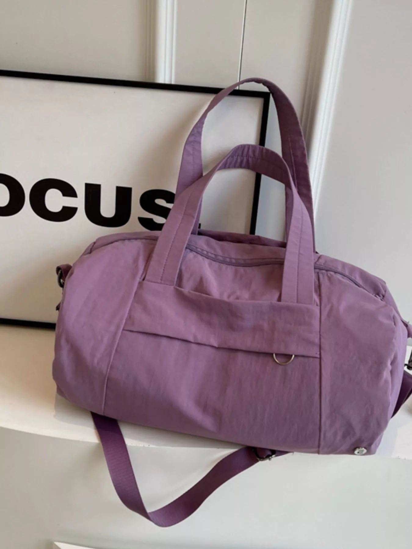 solid color lightweight travel duffel bag - styled view