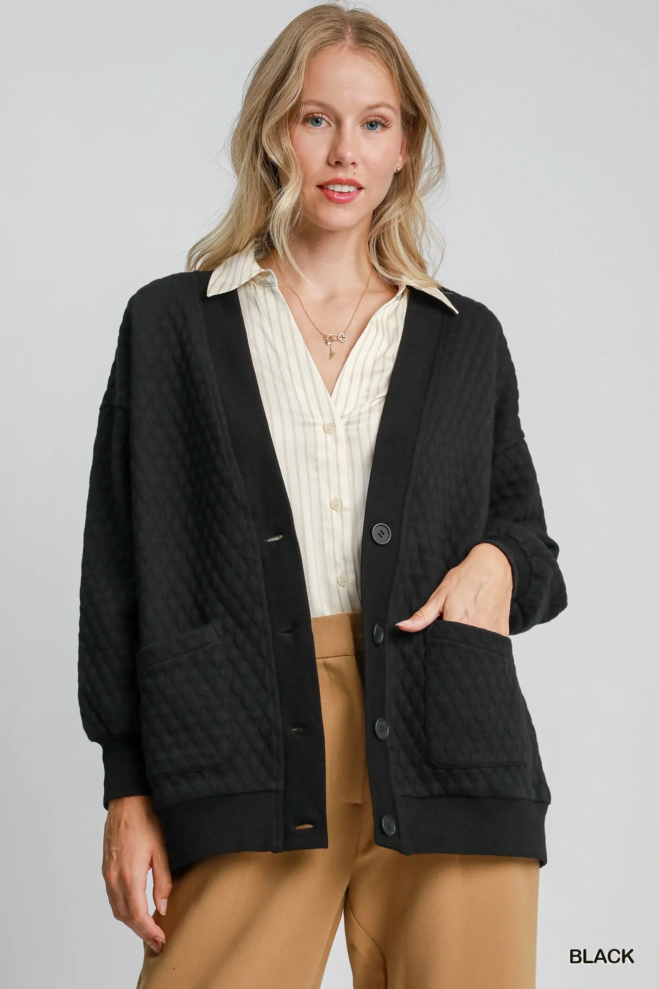 hooded outerwear jacket in city snow